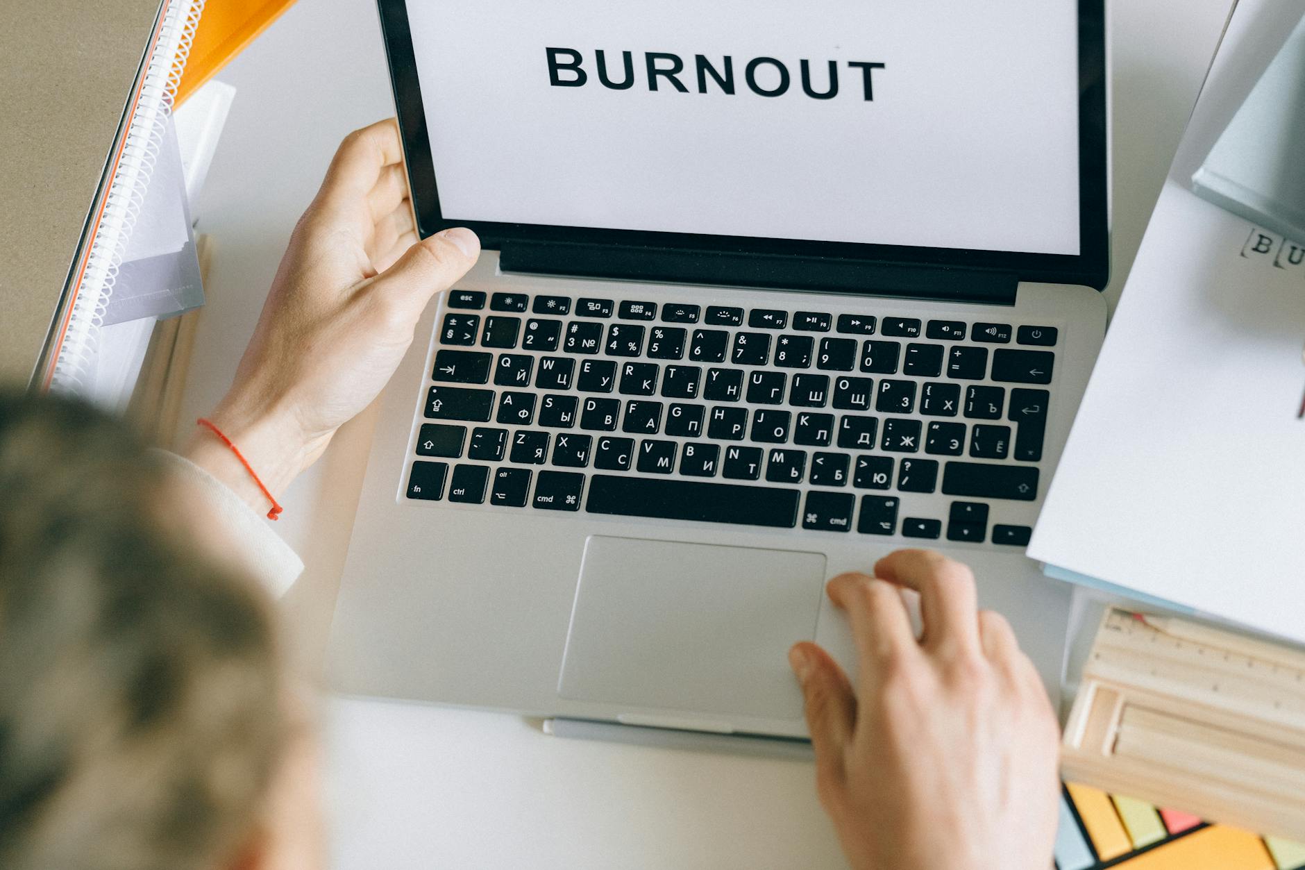 person using gray laptop